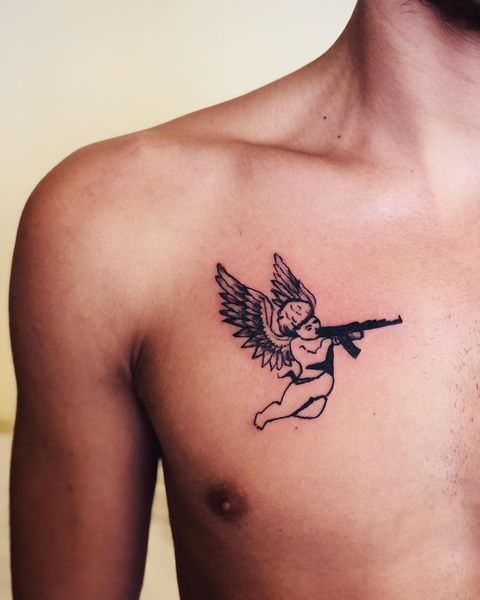 HAINK  A Cupid with semiautomatic gun tattoo  Facebook