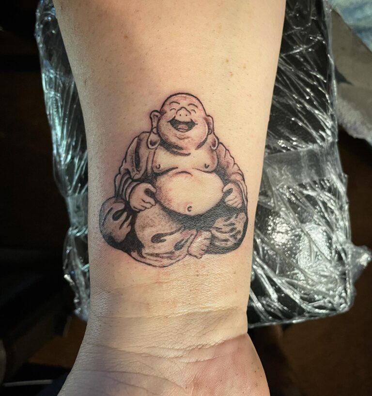 40 Best Laughing Buddha Tattoo Ideas January 2024   Simple Laughing Buddha Wrist Tattoo Subtle Reminder Of Happiness 768x818 