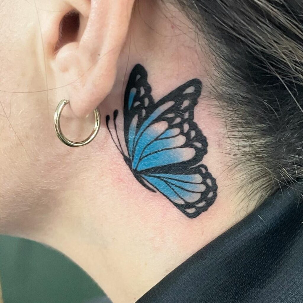 Big tattoo butterfly behind ear