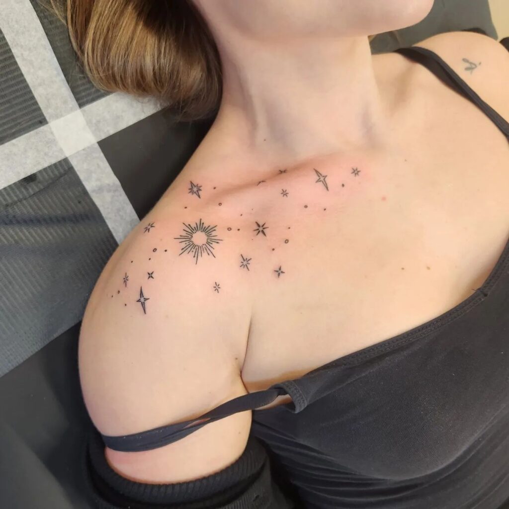 Space enchantment shoulder tattoos with a space theme for females