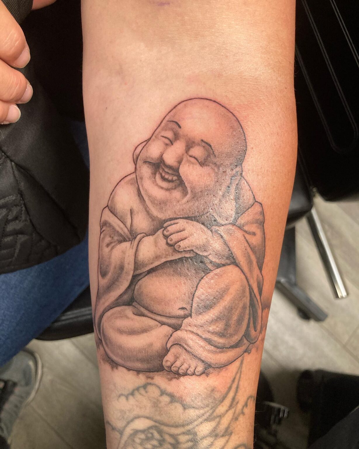 40 Best Laughing Buddha Tattoo Ideas November 2024   Below The Elbow Laughing Buddha Tattoo For Female Subtle Elegance 1229x1536 