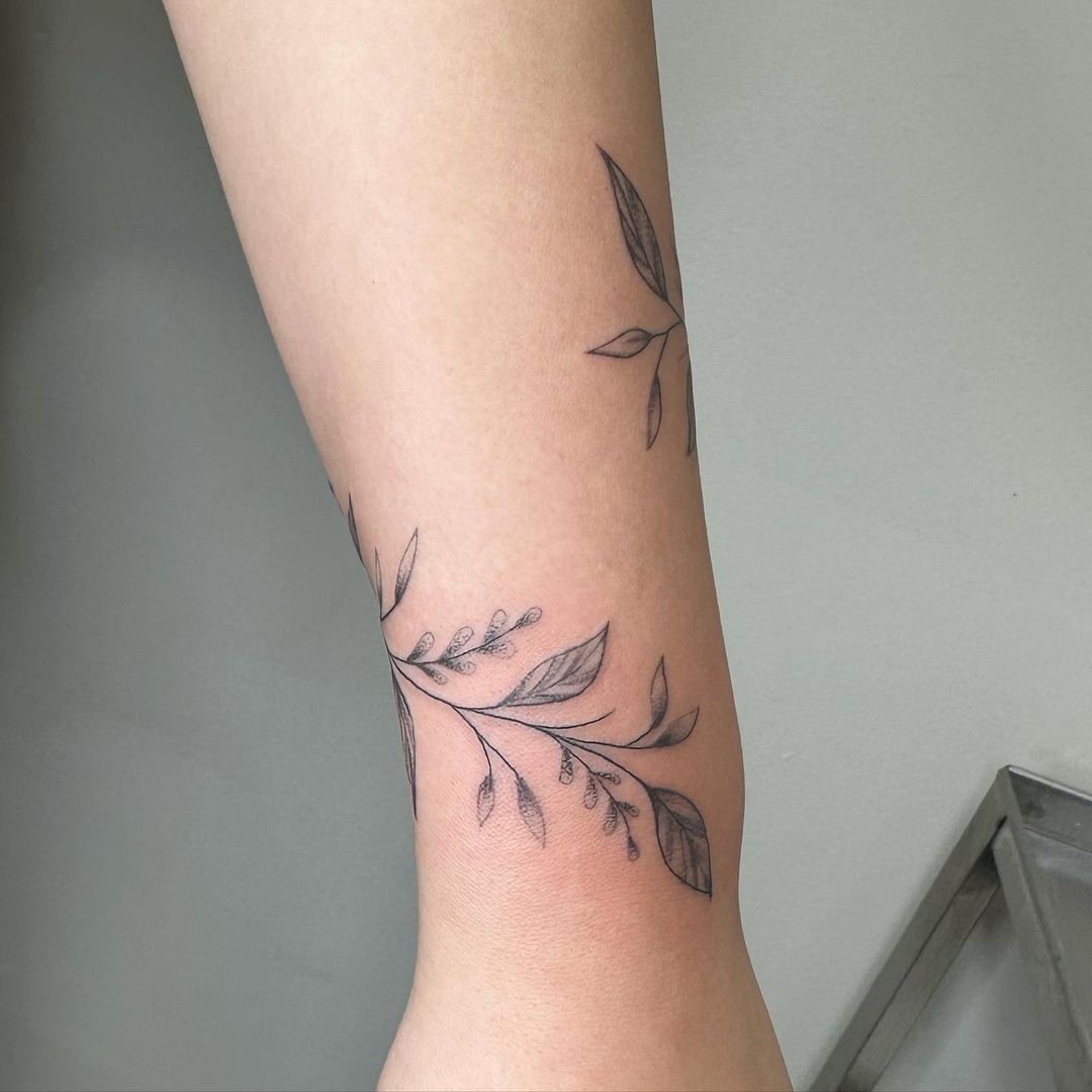 Beautiful floral wrist wrap tattoo a feminine design