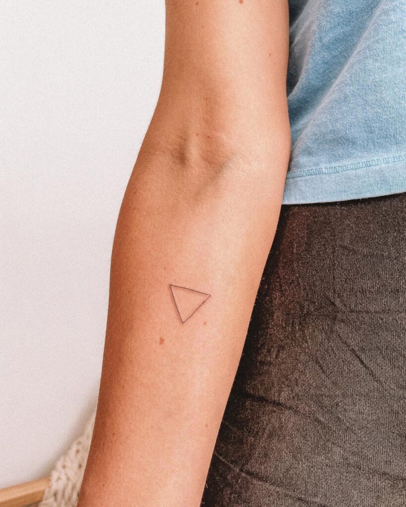 Dotwork triangles tattoo on the forearm - Tattoogrid.net